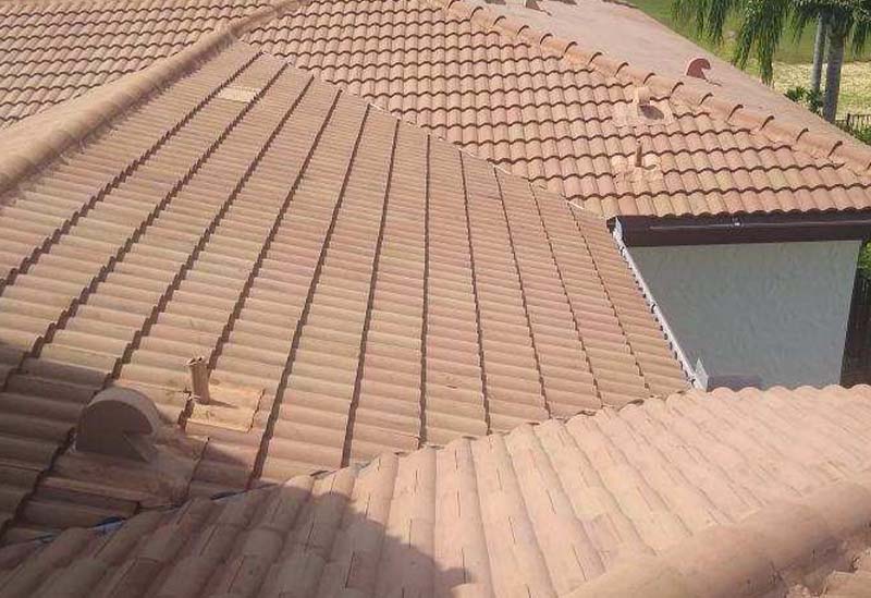 Tile roof of apartment after roof cleaning