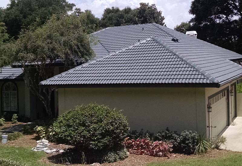 The roof of a house after sealing and painting