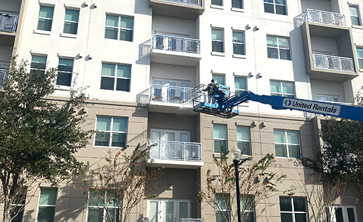 Apartment complex undergoing exterior cleaning