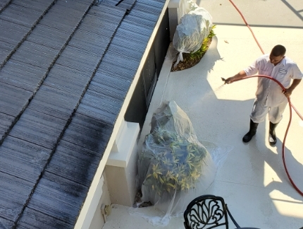 Mallard Staff cleaning outside pool deck area